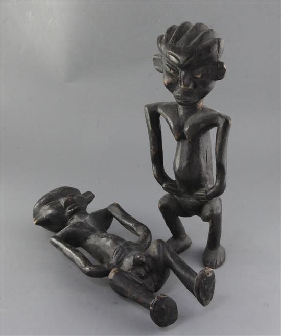 A pair of African ebonised wood fertility figures, 42cm